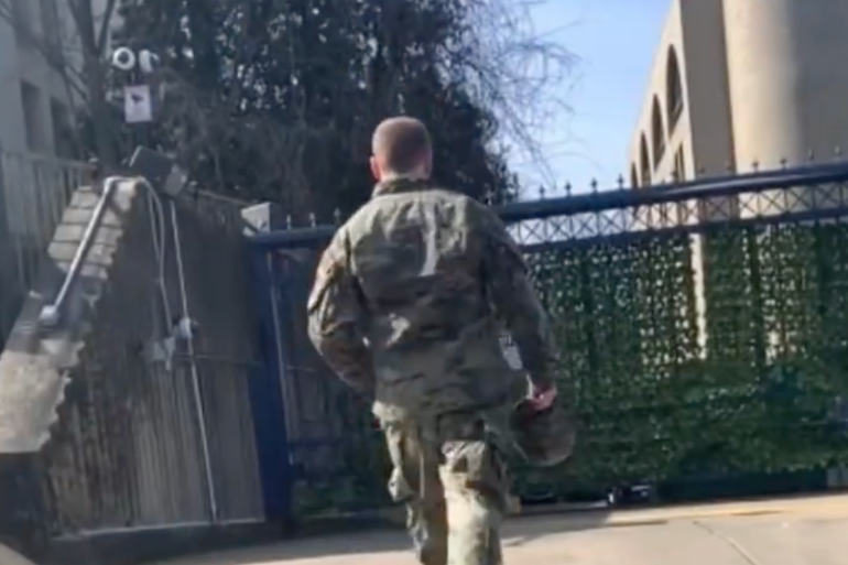 A TV Screen grab of US airman Aaron Bushnell walking towards the Israeli Embassy in Washington, DC., where he set himself ablaze while shouting 'free Palestine' on Sunday.
