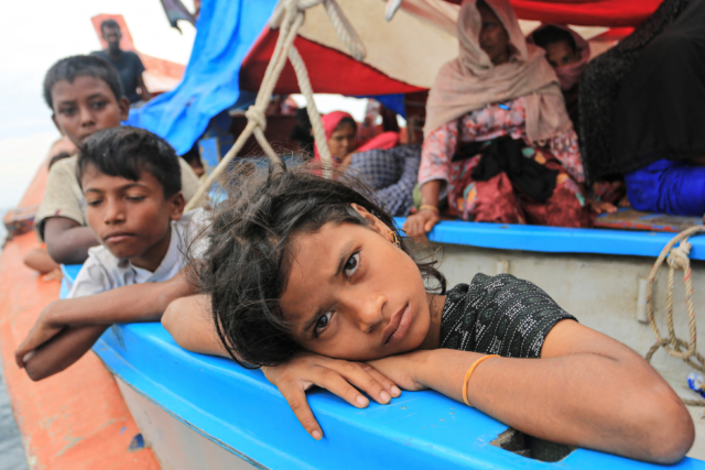 A Rohingya refugee child looks on as she is stranded due to a boat engine failure in the waters of South Aceh, Aceh province, Indonesia, October 20, 2024,