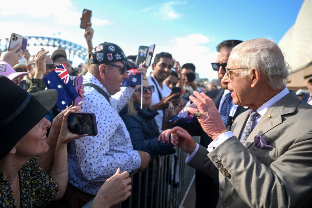 Britain's King Charles being greeted by crowds during his visit to Sydney Opera House
