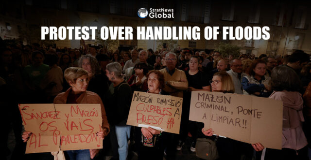 People hold placards as civil groups and unions protest against Valencia's regional leader Carlos Mazon and the management of the emergency response to the deadly floods in eastern Spain, in Valencia, Spain, November 9, 2024. REUTERS/Eva Manez
