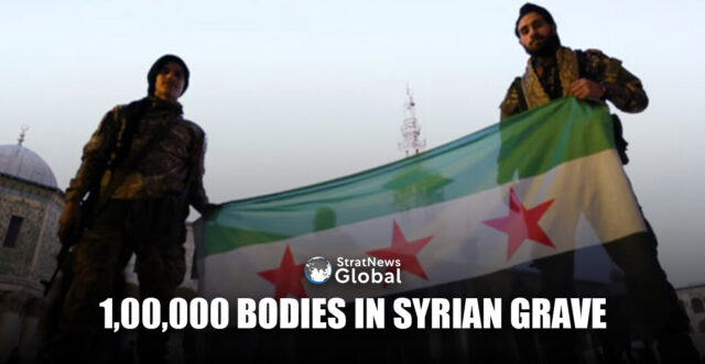 Rebel fighters pose as they hold a Syrian opposition flag inside the Umayyad Mosque, after rebels seized the capital and ousted Syria's Bashar al-Assad, in Damascus, Syria December 9, 2024. REUTERS/Amr Abdallah Dalsh