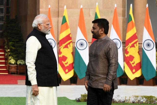 Sri Lanka's President Anura Kumara Dissanayake speaks with India's PM Modi during a photo opportunity ahead of their meeting at Hyderabad House in New Delhi