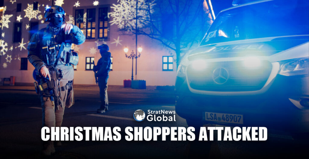 Members of police work at a Christmas market after a car drove into a group of people, in Germany