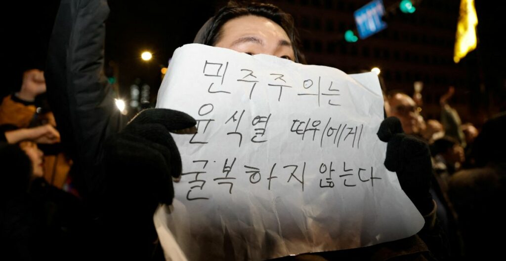 A man holding a placard in Seoul