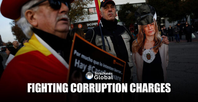 Anti-Sanchez protesters hold a cardboard image of Begona Gomez, wife of Spanish Prime Minister Pedro Sanchez, as she appears before a judge to testify over allegations of corruption and influence peddling that spurred her husband to consider resigning in April, in Madrid, Spain, December 18, 2024. REUTERS/Susana Vera