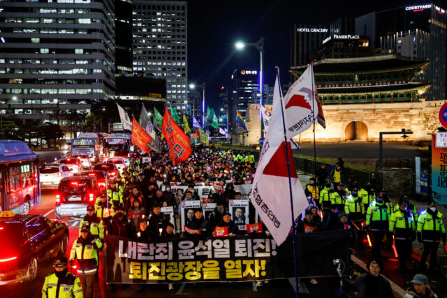 People protest during a candlelight vigil calling for the resignation of South Korean President Yoon Suk Yeol, in Seoul