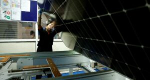 India On Track In Meeting Climate Commitments A technician working on the assembly line at a solar panel manufacturing hub in Greater Noida, on the outskirts of New Delhi India, October 23, 2024. REUTERS/Priyanshu Singh