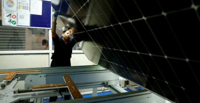 A technician working on the assembly line at a solar panel manufacturing hub in Greater Noida, on the outskirts of New Delhi India, October 23, 2024. REUTERS/Priyanshu Singh
