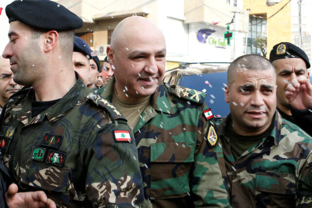 23B6A5CLDBM3BGDQBG6XQXGABY Rice is thrown on Newly-appointed General Joseph Aoun (C) as army commander, upon his arrival at his family's house in Sin El Fil, northeast of Beirut, Lebanon March 8, 2017. REUTERS/Mohamed Azakir/File Photo