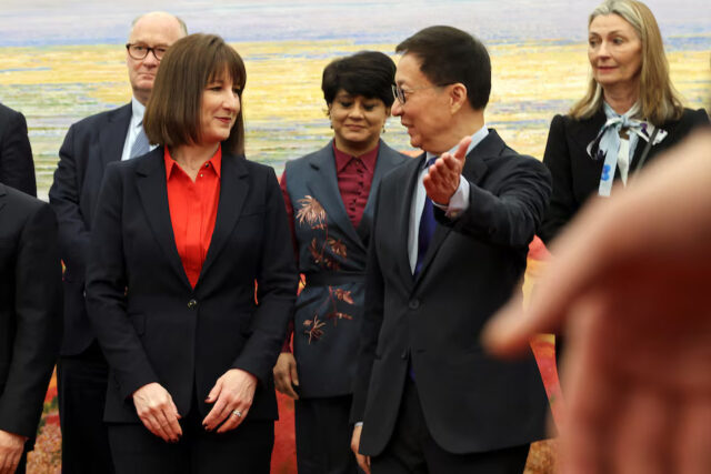 Chinese Vice President Han Zheng gestures to Britain's Chancellor of the Exchequer Rachel Reeves following a family photo session at the Great Hall of the People in Beijing, China January 11, 2025. REUTERS/Florence Lo/Pool