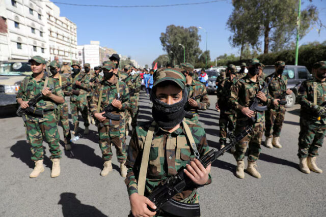 F7T76CBH7NN6HICSYDZMOOJL6Q Houthi fighters take part in a parade for people who attended Houthi military training as part of a mobilization campaign, in Sanaa, Yemen December 18, 2024. REUTERS/Khaled Abdullah/File Photo