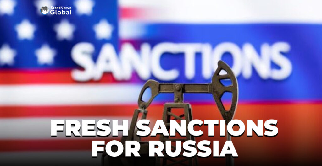 A model of a pump jack is seen in front of the displayed word "Sanctions", U.S. and Russia flag colours in this illustration taken March 8, 2022. REUTERS/Dado Ruvic/Illustration/File Photo