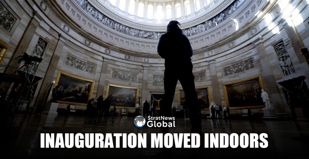 People stand at the rotunda where the inaugural address will take place after it was announced U.S. President-elect Donald Trump's inauguration is being moved indoors due to dangerously cold temperatures expected on Monday, in Washington