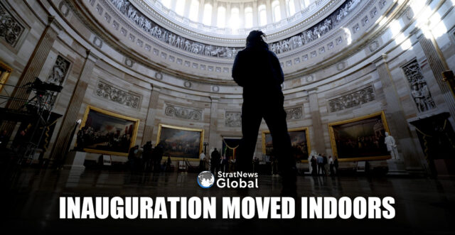 People stand at the rotunda where the inaugural address will take place after it was announced U.S. President-elect Donald Trump's inauguration is being moved indoors due to dangerously cold temperatures expected on Monday, in Washington