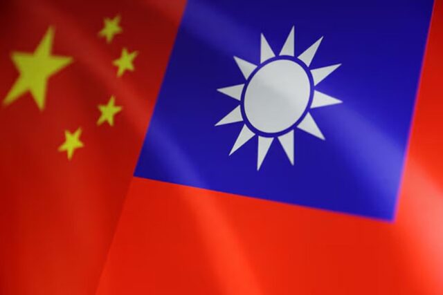 Taiwan coast guard Chinese and Taiwanese flags are seen in this illustration, August 6, 2022. REUTERS/Dado Ruvic/Illustration/File Photo