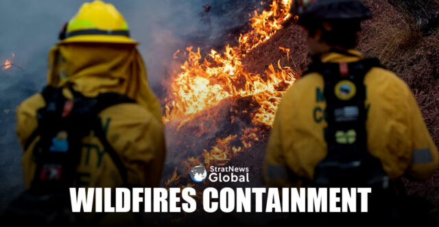Firefighters watch as the Palisades Fire, one of simultaneous blazes that have ripped across Los Angeles County, burns at the Mandeville Canyon, a neighborhood of Los Angeles, California, U.S. January 11, 2025. REUTERS/Ringo Chiu