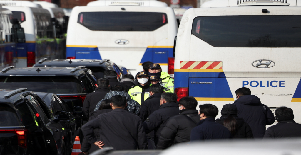 Police officers and investigators leave impeached South Korean President Yoon Suk Yeol's official residence