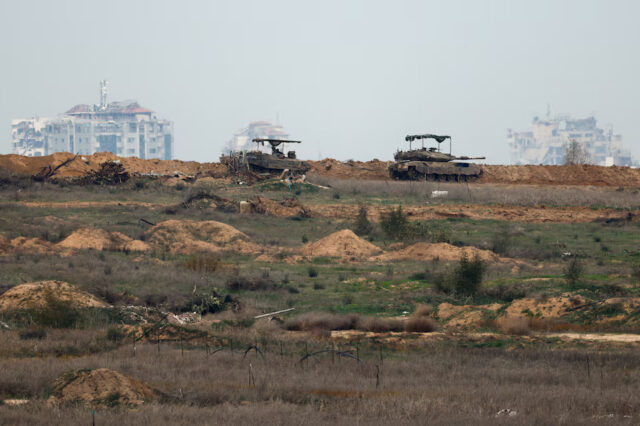 4LCLVKOMT5M7LLTKKWLYA4WWMI Israeli military vehicles operate in Gaza, amid a ceasefire between Israel and Hamas, as seen from Israel, February 9, 2025. REUTERS/Amir Cohen