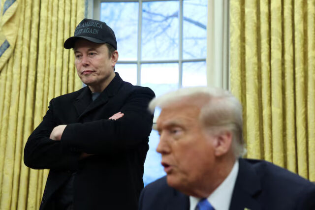 5XRUI4DJ2NL6PA7D6L2P5QHTA4 Elon Musk listens to U.S. President Donald Trump speak in the Oval Office of the White House in Washington, D.C., U.S., February 11, 2025. REUTERS/Kevin Lamarque/ File Photo