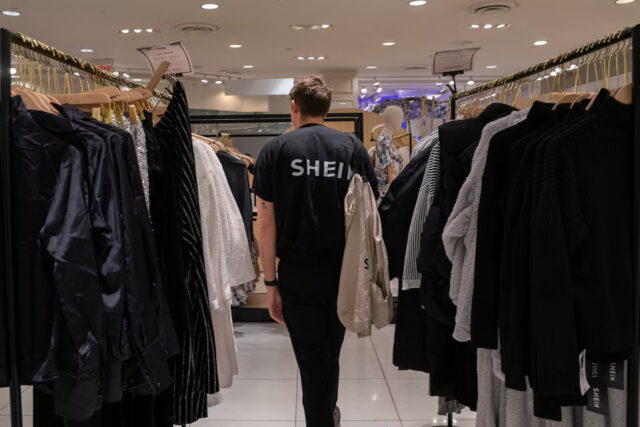 MAFX7PTWKVKJBPRSPZXDKOPYJQ An employee at the Shein Holiday pop-up shop inside of Times Squares Forever 21 in New York City, U.S., November 10, 2023.REUTERS/David 'Dee' Delgado/File Photo