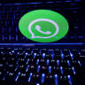 A keyboard is placed in front of a displayed WhatsApp logo in this illustration taken February 21, 2023. REUTERS/Dado Ruvic/Illustration/File Photo