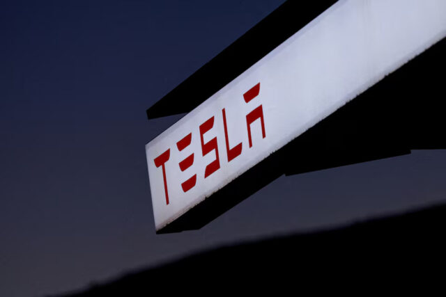 SLO2UJT3KBNQLDM6EFMUJDT6CE A view of Tesla logo at an electric vehicle charging station between Los Angeles and Las Vegas in Baker, California, U.S., November 19, 2024. REUTERS/Mike Blake/File Photo