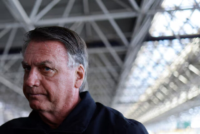 UAYL4FXJYVMZVLZWRJUG5IHAW4 Brazil's former President Jair Bolsonaro accompanied by his wife Michelle Bolsonaro (not pictured) arrive at Brasilia International Airport, as she departs for the inauguration of U.S. President Donald Trump, in Brasilia, Brazil, January 18, 2025. REUTERS/Ueslei Marcelino/File Photo