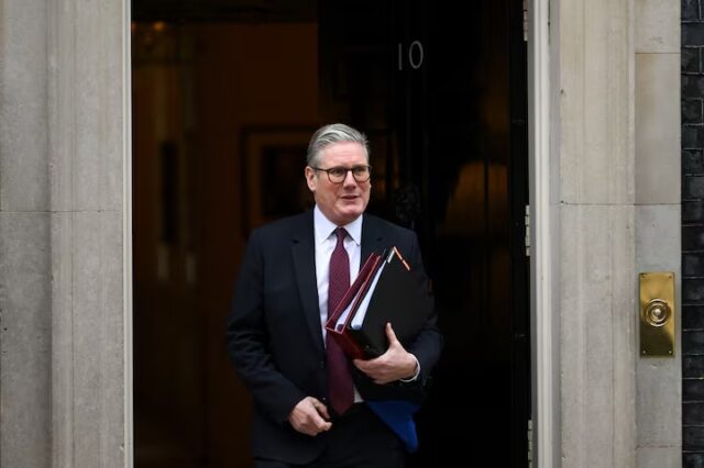 UK-PM British Prime Minister Keir Starmer walks outside 10 Downing Street in London, Britain, February 12, 2025. REUTERS/Jaimi Joy/File Photo