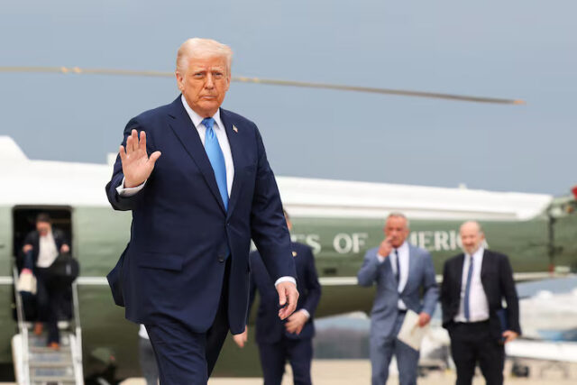 6MSJZV4H5RNIDI4ITMOIPSV2ZE U.S. President Donald Trump walks to board Air Force One, as he departs for Florida, at Joint Base Andrews, Maryland, U.S., March 28, 2025. REUTERS/Kevin Lamarque/File Photo