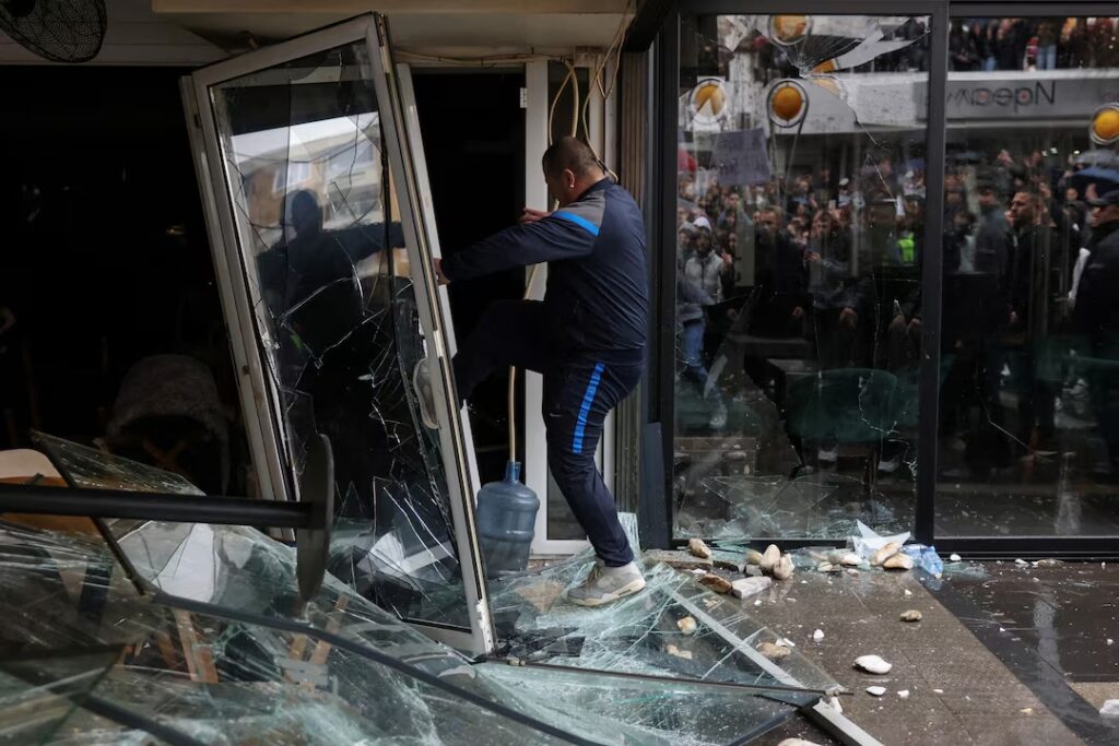 People smash a pub, which according to protesters belongs to the owner of Pulse nightclub, following a fire in the club that resulted in dozens of deaths, in the town of Kocani, North Macedonia, March 17, 2025. REUTERS/Alexandros Avramidis