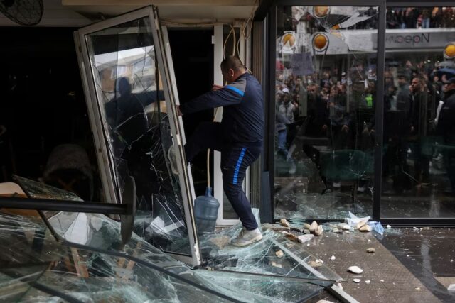 C43KIFU4WFNZRIF5ASXV7QS3GM People smash a pub, which according to protesters belongs to the owner of Pulse nightclub, following a fire in the club that resulted in dozens of deaths, in the town of Kocani, North Macedonia, March 17, 2025. REUTERS/Alexandros Avramidis