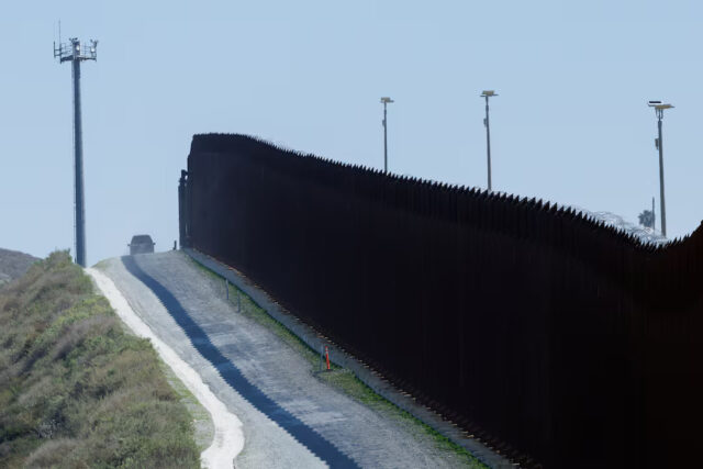 MJA47TMQONIPZINYNXSU3WL5EE Electronic monitoring equipment is shown along the border wall between Mexico and the United States in San Diego, California, U.S., March 21, 2025. REUTERS/Mike Blake