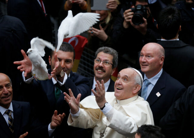 FILE PHOTO: Pope Francis releases dove prior to delivering Holy Mass at Holy Spirit Cathedral in Istanbul Pope Francis