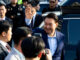 Ousted former South Korean President Yoon Suk Yeol waves to his supporters as he moves out of the presidential residence in Seoul, South Korea, April 11, 2025. Yonhap/via REUTERS/File Photo