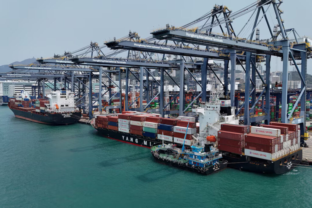 A drone view shows containers at the terminals at the port in Kwai Chung in Hong Kong, China, April 3, 2025. REUTERS/Tyrone Siu