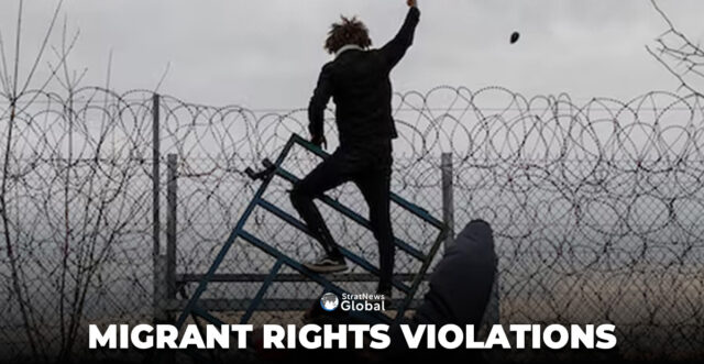 A migrant throws a stone, while others climb a fence at the border, as they clash with Greek riot police at Turkey's Pazarkule border crossing with Greece's Kastanies, near Edirne, Turkey, March 6, 2020. REUTERS/Marko Djurica/File Photo