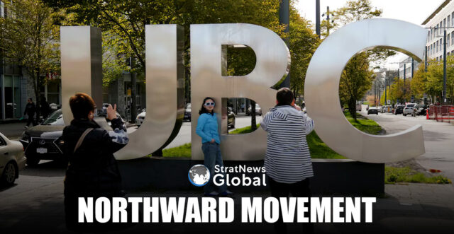 Family members take photographs at the entrance of the University of British Columbia (UBC) in Vancouver, British Columbia, Canada April 14, 2025. REUTERS/Chris Helgren