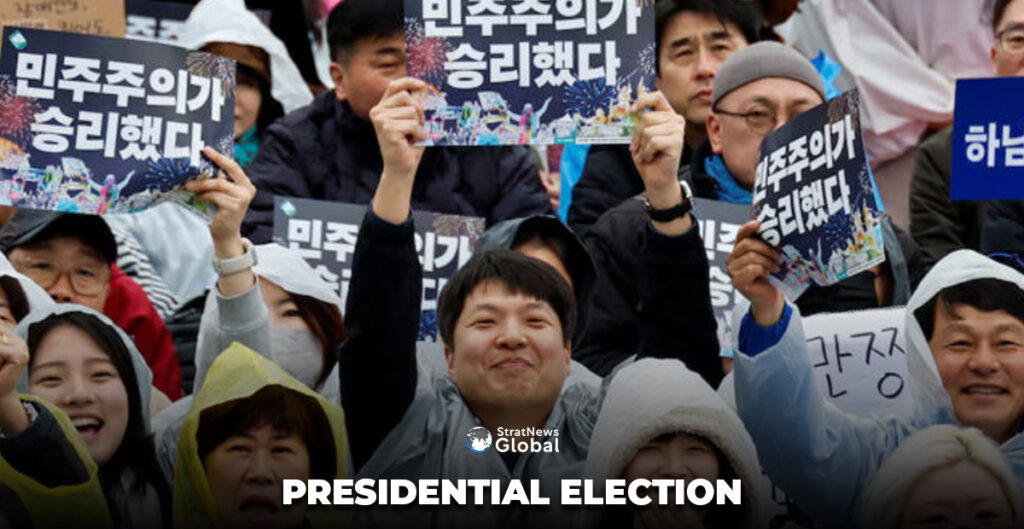 People holding placards that read "Democracy won" attend a rally to celebrate the expulsion of South Korean President Yoon Suk Yeol in Seoul, South Korea, April 5, 2025. REUTERS/Kim Soo-hyeon/File Photo