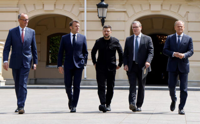 A6OJM6FJU5NZXHFP2H677XF2OE German Chancellor Friedrich Merz, French President Emmanuel Macron, Ukranian President Voloydmyr Zelenskyy, British Prime Minister Keir Starmer and Polish Prime Minister Donald Tusk walk in the grounds of the Mariynsky Palace, in Kyiv, Ukraine, May 10, 2025. Ludovic Marin/Pool via REUTERS/File Photo