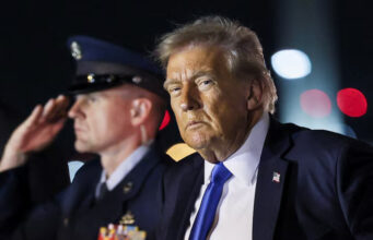 U.S. President Donald Trump looks on after disembarking from Air Force One at Palm Beach International Airport, West Palm Beach, Florida, U.S. May 1, 2025. REUTERS/Leah Millis/File Photo