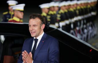 French President Emmanuel Macron gestures upon his arrival at military airbase Halim Perdanakusuma in Jakarta, Indonesia, May 27, 2025. REUTERS/Ajeng Dinar Ulfiana