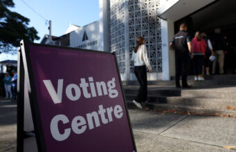 People enter a pre-polling centre in the seat of Warringah, Sydney, Australia, April 29, 2025. REUTERS/Hollie Adams/File Photo