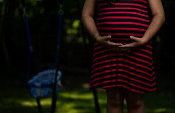 Barbara, a 35-year old pregnant asylum-seeker from Cuba, poses for a portrait in Louisville, Kentucky, U.S., May 9, 2025. REUTERS/Kevin Wurm