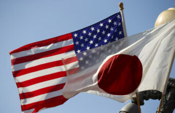 The US and Japan flags fly together outside the White House in Washington April 27, 2015. REUTERS/Kevin Lamarque/File Photo