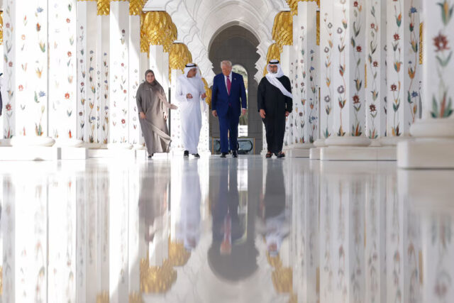 J6QBUPCX6VK2DN5HDGIEYISZGI US President Donald Trump is reflected off the floor as he walks with Yousif Al Obaidli, director of Sheikh Zayed Grand Mosque and Ameena Al Hammadi, acting director of the Culture and Knowledge Department while visiting the Sheikh Zayed Grand Mosque in Abu Dhabi, UAE, May 15, 2025. REUTERS/Brian Snyder