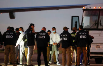 Venezuelan migrants are pat-down before boarding a repatriation flight as a part of an immigration enforcement process, at the Valley International Airport, in Harlingen, Texas, U.S. October 18, 2023. REUTERS/Daniel Becerril/File Photo