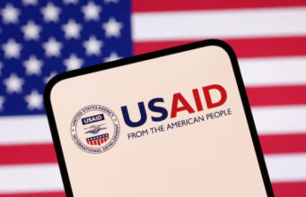 USAID logo and U.S. flag are seen in this illustration taken April 23, 2025. REUTERS/Dado Ruvic/Illustration