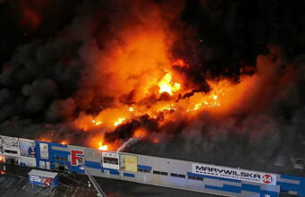 Drone view of the Marywilska 44 shopping centre burning during a massive fire in Warsaw, Poland, May 12, 2024. Dariusz Borowicz/Agencja Wyborcza.pl via REUTERS/File Photo