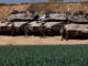 Israeli tanks are positioned near the Israel-Gaza border, in Israel, March 18, 2025. REUTERS/Amir Cohen/File Photo