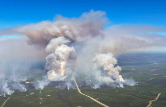 Smoke rises from Edith Lake wildfire SWF076, which forced the evacuation of the nearby town of Swan Hills, Alberta, Canada in an aerial photograph May 28, 2025. Alberta Wildfire/Handout via REUTERS/File Photo
